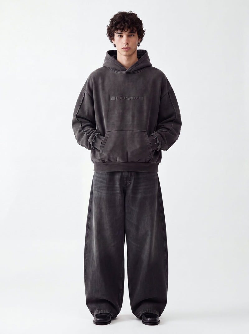 Model wearing the Elusive Core Hoodie, front view