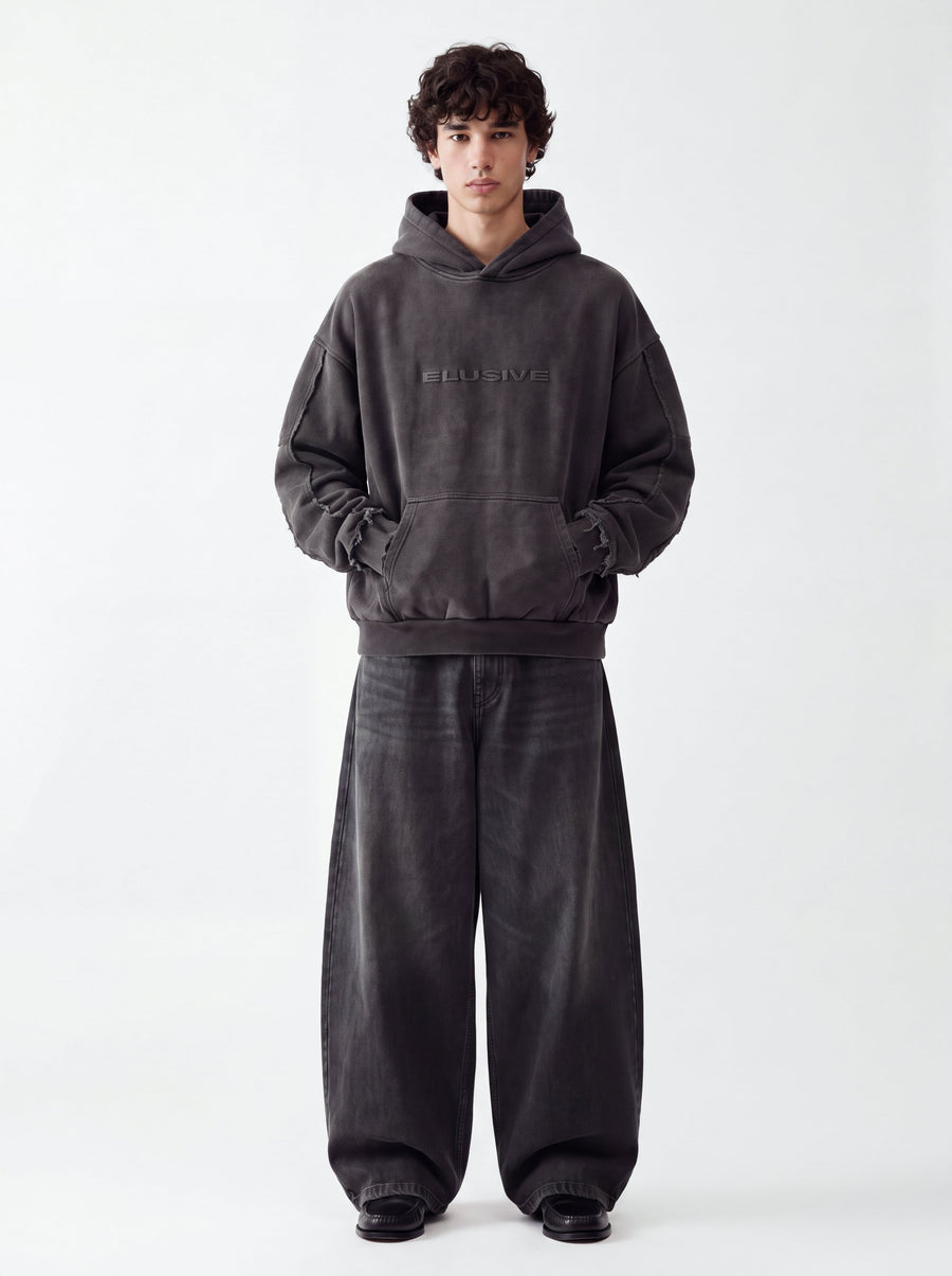 Model wearing the Elusive Core Hoodie, front view