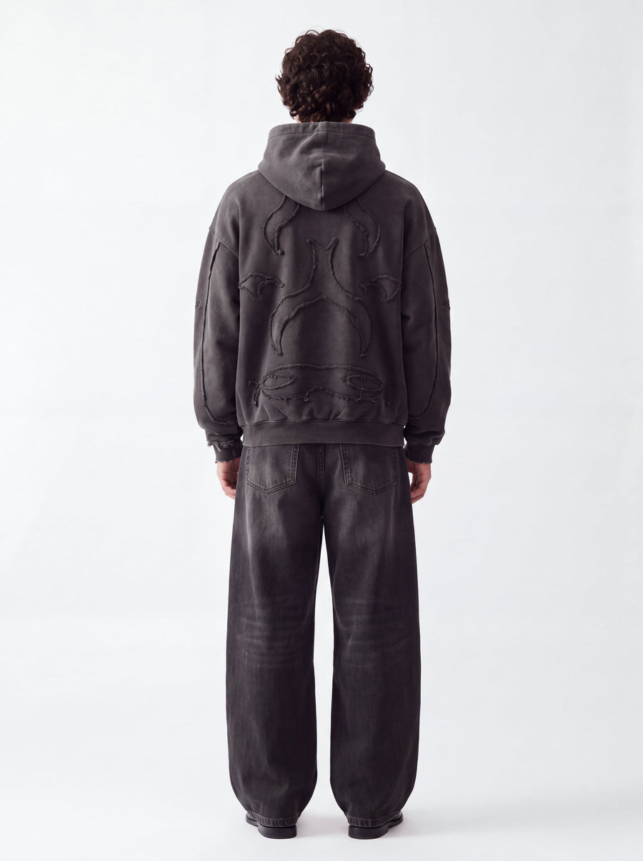 Model wearing the Elusive Core Hoodie, back view