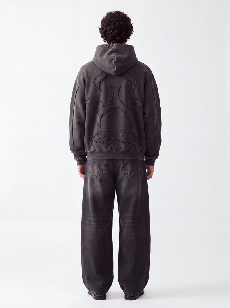 Model wearing the Elusive Core Hoodie, back view